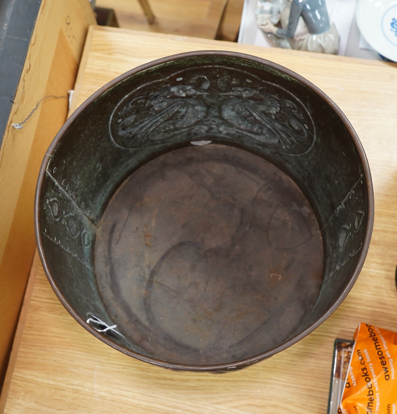 A large Arts and Crafts embossed copper jardiniere decorated with seahorses, stamped Newlyn to base, 28cm high, 33cm in diameter. Condition - good